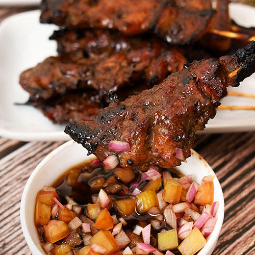 Pork BBQ Skewers Filipino Stock Bundle Filipino pork barbecue stock image set with grilled skewers, plating shots, and close-ups for local food branding and print use